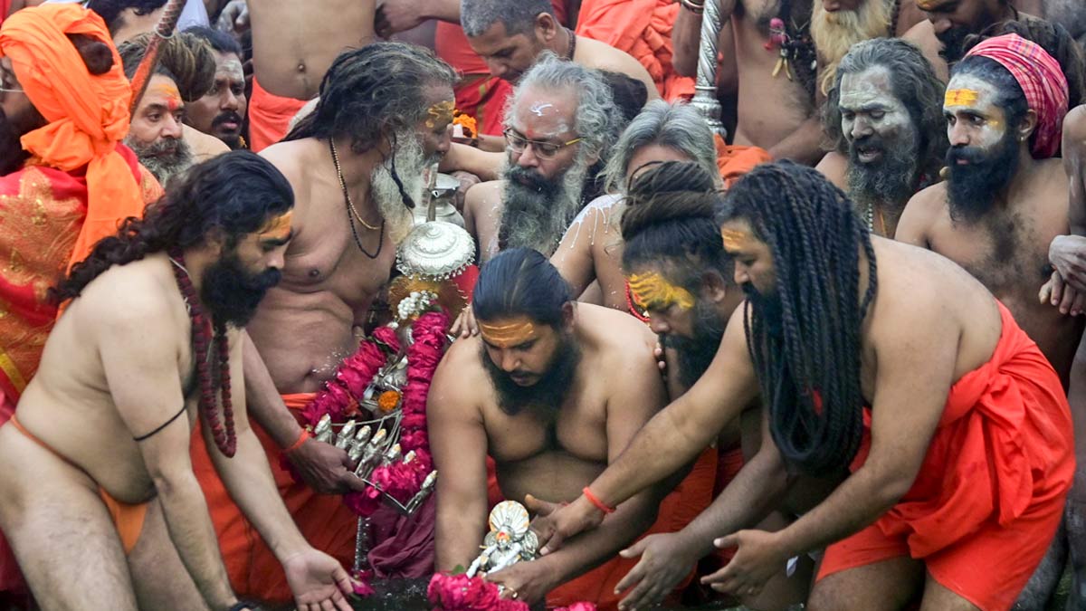Sadhus perform rituals before taking the first 'amrit snan' at the Mahakumbh  | PTI