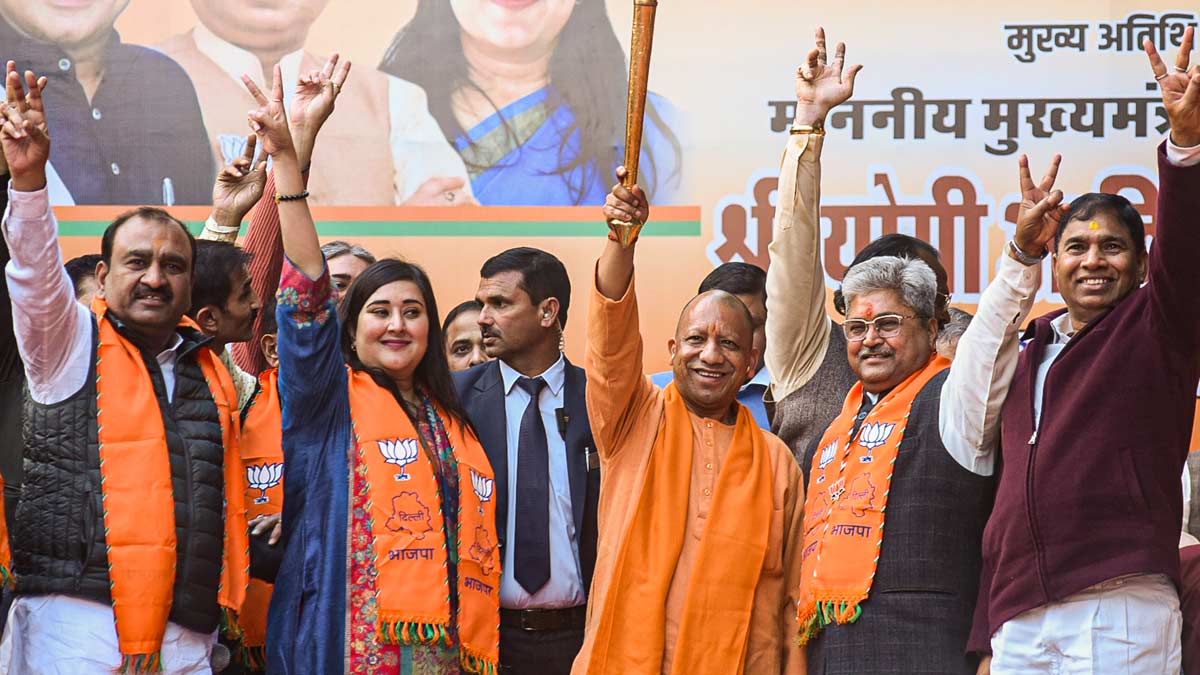 Uttar Pradesh Chief Minister Yogi Adityanath with BJP MP Bansuri Swaraj, party candidate Dushyant Gautam, and others during a public meeting for the upcoming Delhi Assembly elections, in New Delhi | PTI