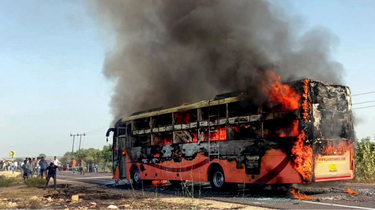 A bus traveling from Jaisalmer to Jodhpur catches fire, near Thaiyat village in Jaisalmer district, Rajasthan, Tuesday, Oct. 14, 2025 | PTI