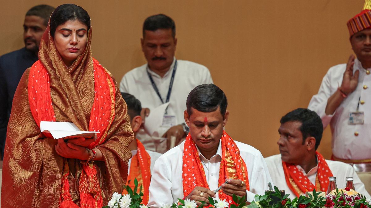 MLA Rivaba Jadeja, wife of cricketer Ravindra Jadeja, takes oath during the swearing-in ceremony of the new Gujarat cabinet, in Gandhinagar, Gujarat | PTI