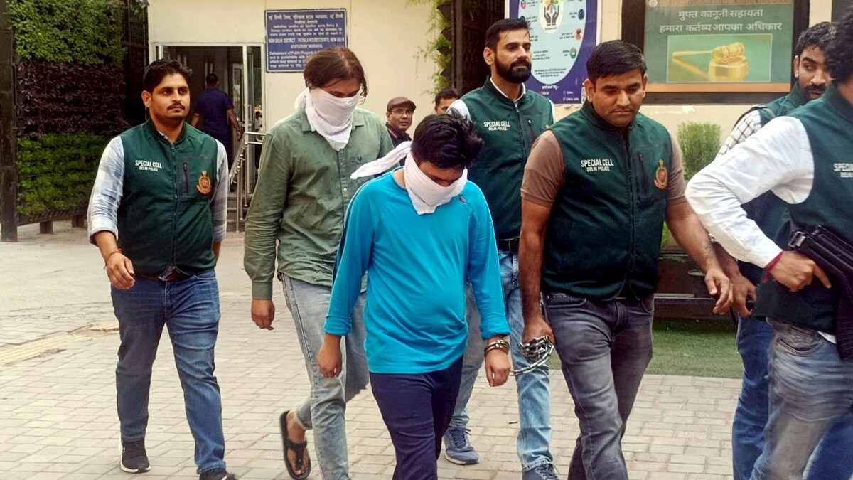  Delhi Police Special Cell personnel with two suspected ISIS operatives while producing them at the Patiala House Court | PTI