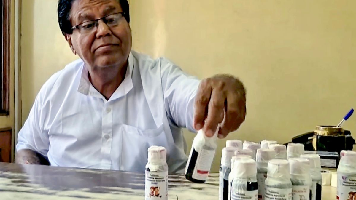 An official looks at bottles of the Coldrif cough syrup | PTI 