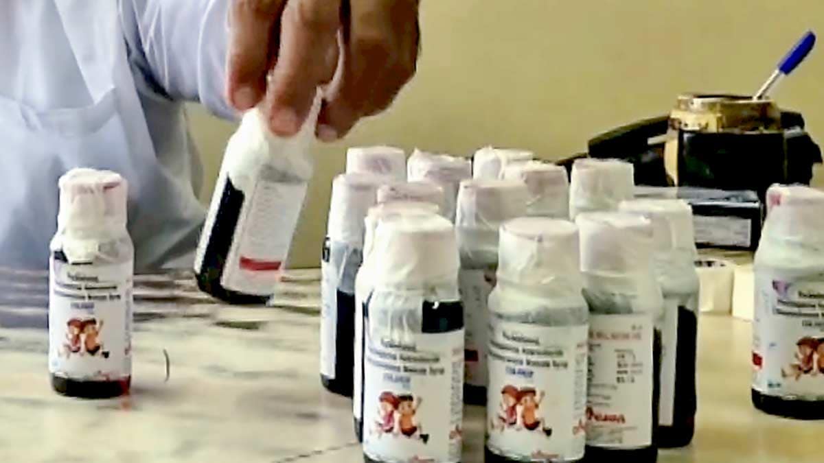 An official looks at bottles of the Coldrif cough syrup after a raid by the Drug and Pharmaceuticals Department officials at Kataria Pharmaceuticals in Jabalpur, Madhya Pradesh | PTI