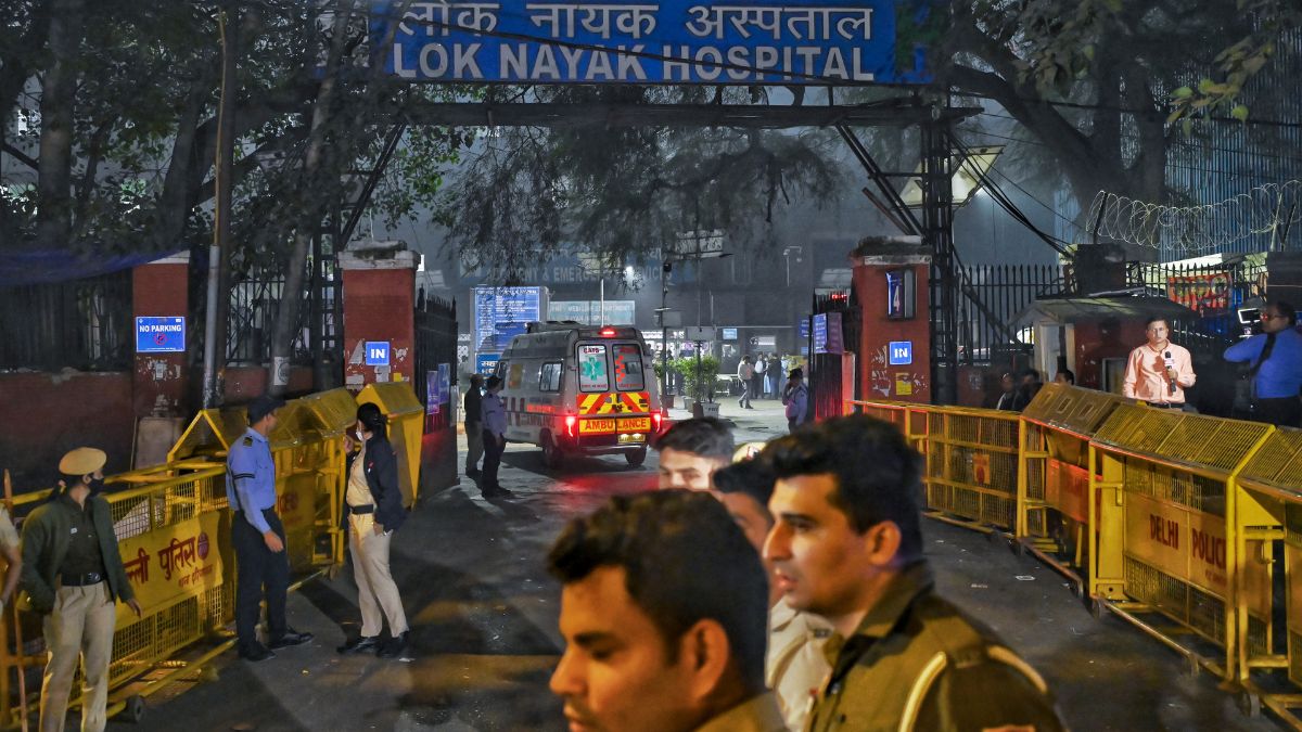 Police personnel at Lok Nayak Hospital after a blast in a parked car near Red Fort left multiple vehicles in flames | PTI