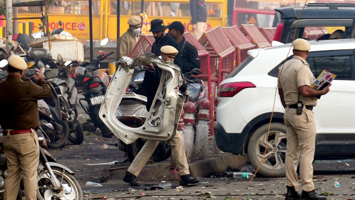 Police personnel at the site in the aftermath of the blast that occurred near Red Fort Metro Station on Monday | PTI