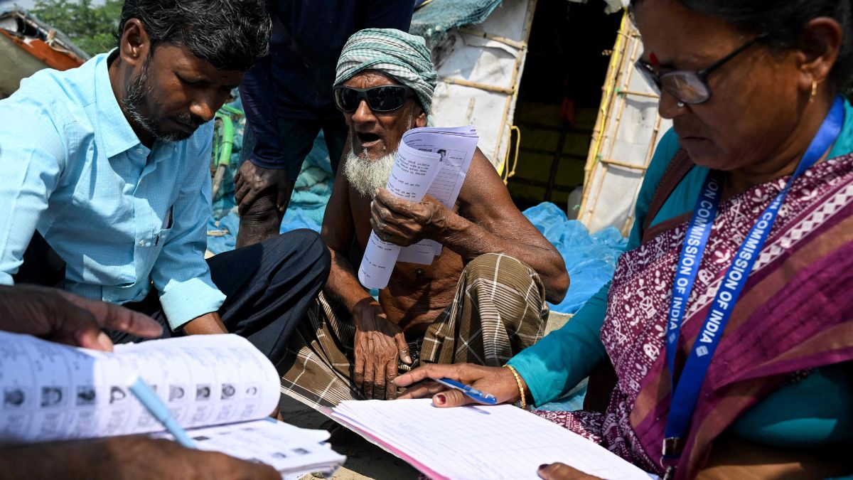 Booth Level Officials  distribute enumeration forms as a part of the Election Commission of India's Special Intensive Revision (SIR) on the Mousuni Island in West Bengal | AFP 