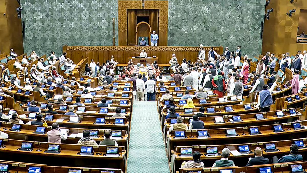 Lok Sabha Speaker Om Birla conducts proceedings in the House amid protest by opposition members in the well on the first day of the Winter Session of Parliament, in New Delhi | PTI