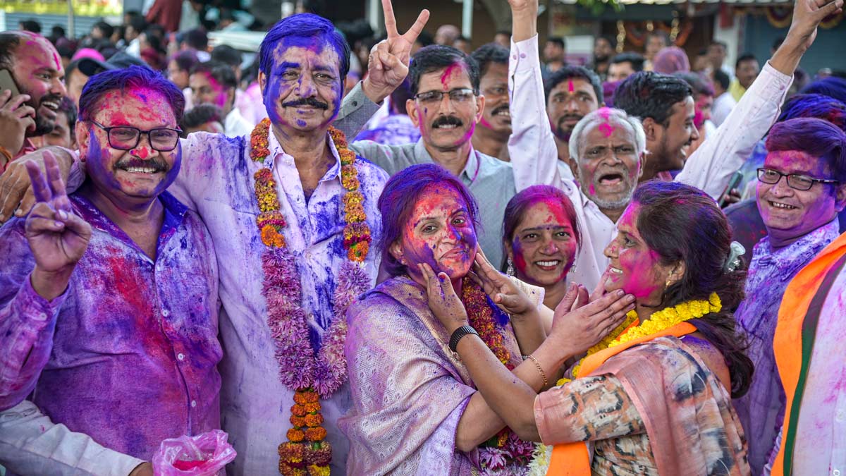A BJP candidate celebrates with supporters after winning the Maharashtra local body elections in Wadi | PTI