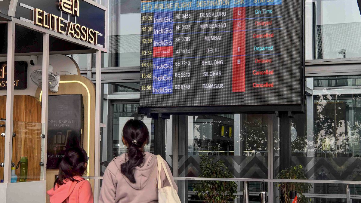 Passengers check updates on the display board amid IndiGo flight disruptions, at Netaji Subhash Chandra Bose International Airport in Kolkata | X 
