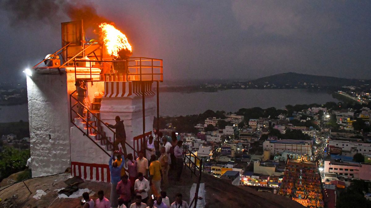 A lamp lit at Thiruparankundram temple as part of 'Karthigai Deepam' festival celebrations in Madurai district | PTI
