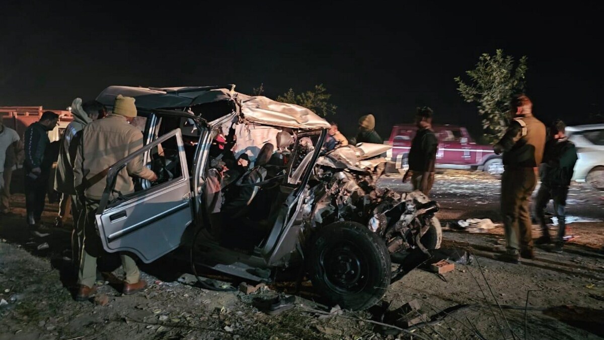 Police personnel check the wreckage at the site after a collision between a bus and a Bolero car which was carrying devotees to the Maha Kumbh | PTI 