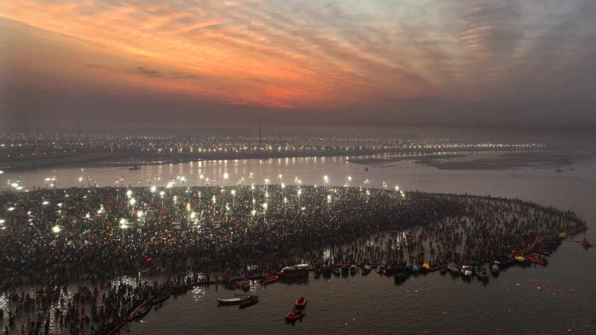 Devotees take ritualistic dips at the Triveni Sangam on the final day of Mahakumbh festival, in Prayagraj | AP