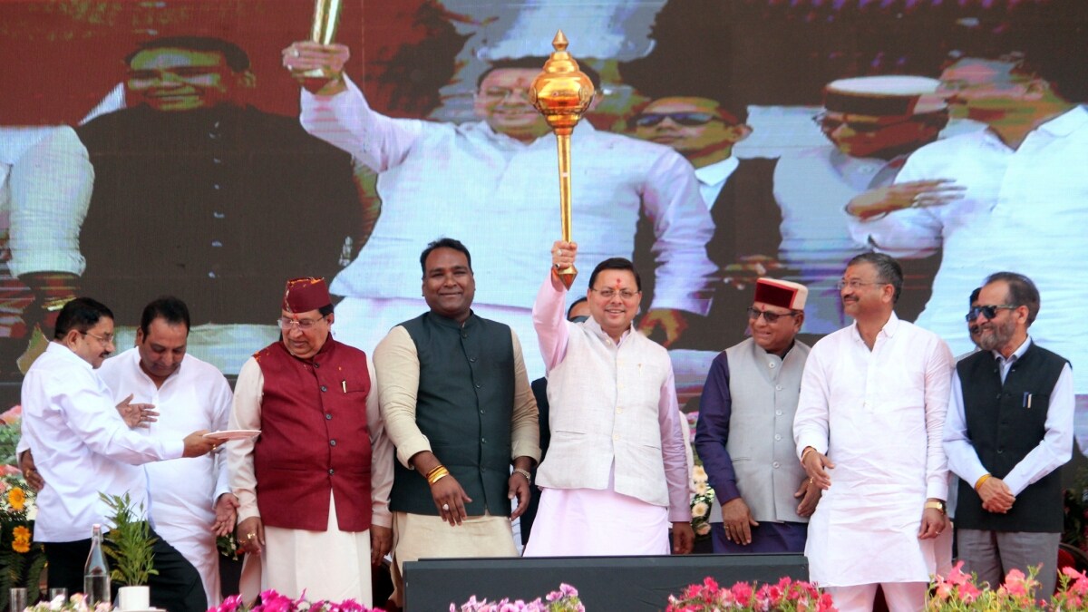 Uttarakhand Chief Minister Pushkar Singh Dhami holds a mace during a function on the completion of three years his government in Dehradun | PTI