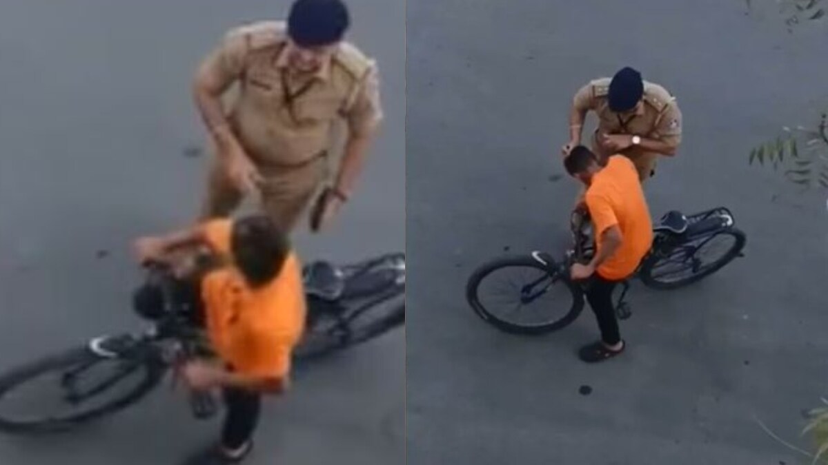 The Gujarat Police SI was caught on camera scolding and beating a minor boy | X