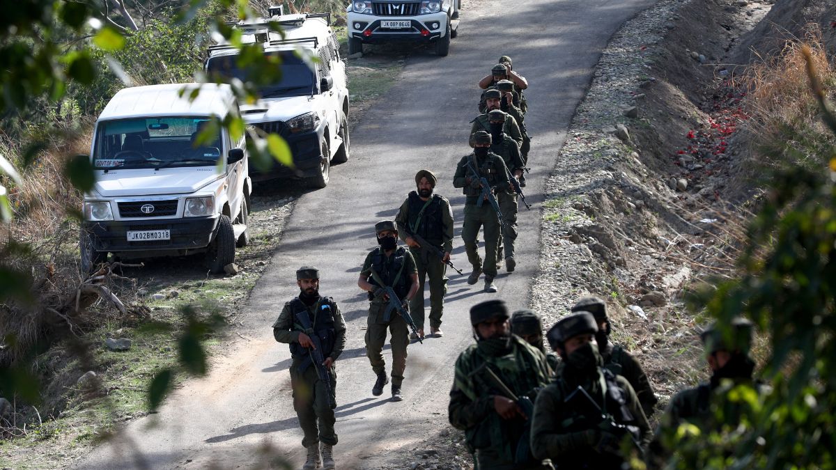 Security force personnel patrol near the site of a gun battle with suspected militants in a forest area in Kathua district of Jammu and Kashmir | PTI