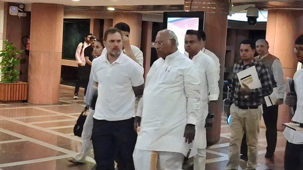 Congress leaders Rahul Gandhi and Mallikarjun Kharge leave the Parliament Annexe building after attending an all-party meeting.