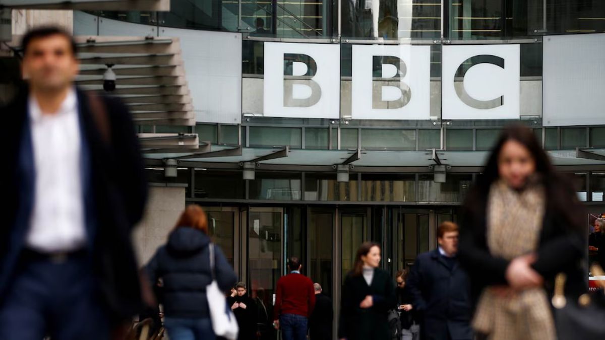 Pedestrians walk past a BBC logo at Broadcasting House in London, Britain | Reuters