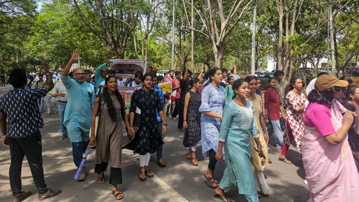 Students and members of University of Hyderabad Teachers Association (UHTA) take part in a protest rally against the state government's plans to develop the 400-acre land parcel bordering the varsity land, in Hyderabad | PTI