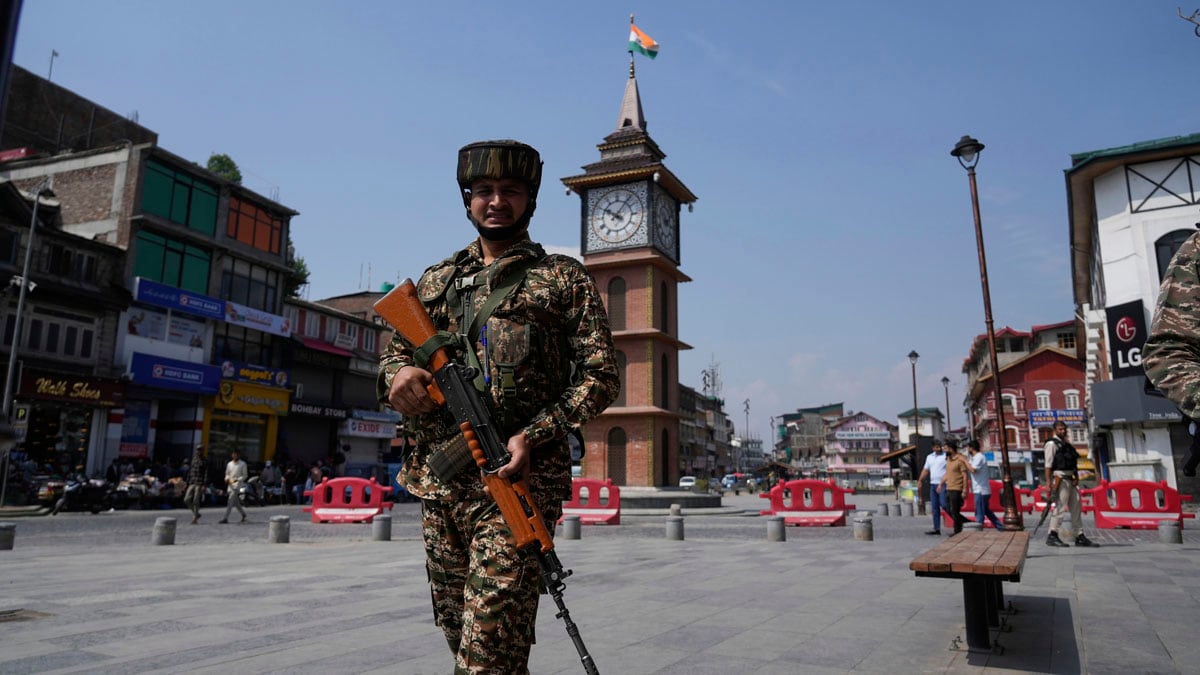 An Indian soldier patrols as he guard near a clock tower day after the ceasefire between Indian and Pakistan in Srinagar, in Indian controlled Kashmir, Sunday, May 11, 2025.(AP Photo/Mukhtar Khan)