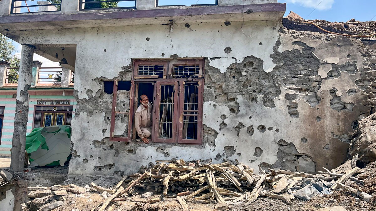 Poonch: A man stands inside a house damaged after cross border shelling by Pakistan, during the ongoing military conflict between India and Pakistan, at Behra village of Mendhar sector, in Poonch district, Jammu and Kashmir, Saturday, May 10, 2025. (PTI Photo) (PTI05_10_2025_000181B)