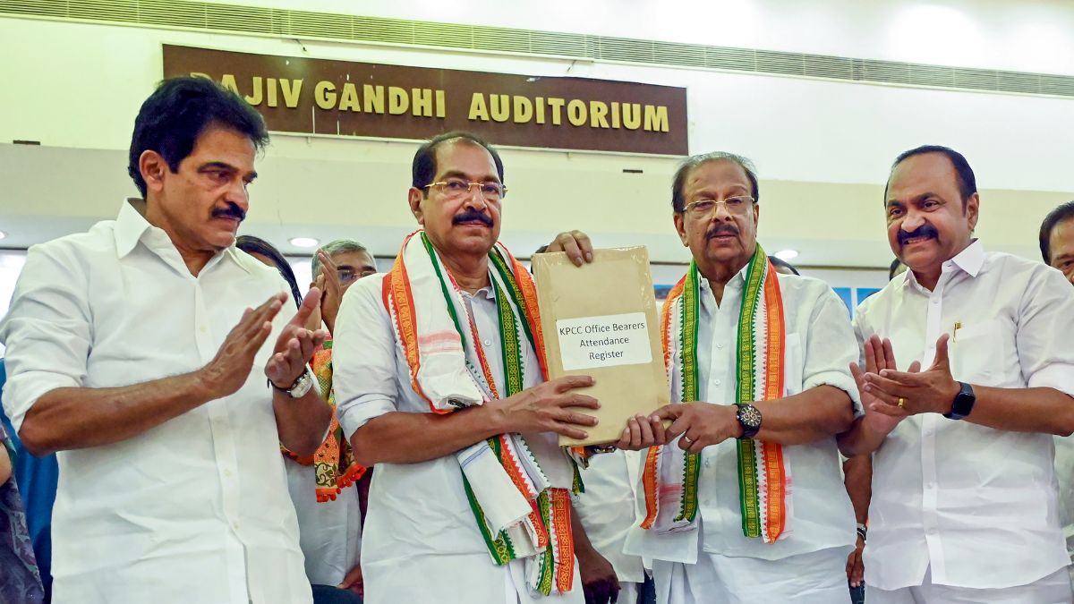 Former Kerala Pradesh Congress Committee (KPCC) president K Sudhakaran hands over a register to newly elected KPCC President Sunny Joseph in the presence of Congress leader KC Venugopal and LoP in the Kerala Assembly V D Satheesan | PTI