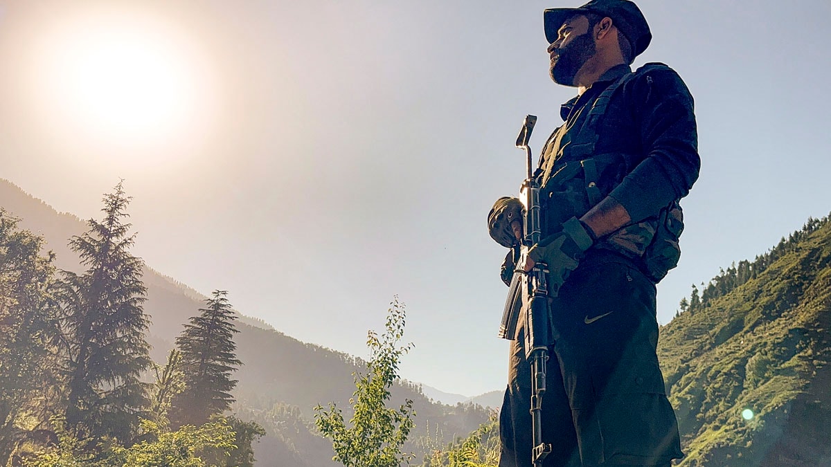 Kishtwar: A security personnel guards during an encounter with terrorists in Kishtwar district of Jammu and Kashmir, Thursday, May 22, 2025. (PTI Photo)   (PTI05_22_2025_000393A)