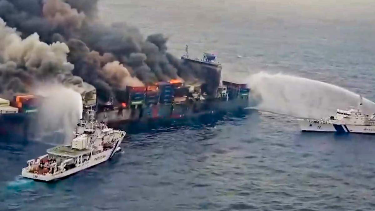 Indian Coast Guard ships carry out the firefighting operation after a fire broke out on a Singapore-flagged ship following a container explosion off the Kerala coast | PTI