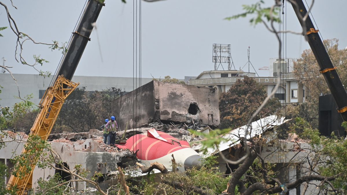 Cranes removing the crashed Air India flight's tail from the wreckage in Ahmedabad on June 14, 2025 | Amey Mansabdar