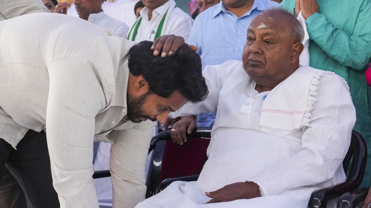 JDS youth wing President Nikhil Kumaraswamy seeks blessings of his grandfather and former PM H.D. Deve Gowda in Bengaluru on June 15, 2025 | PTI