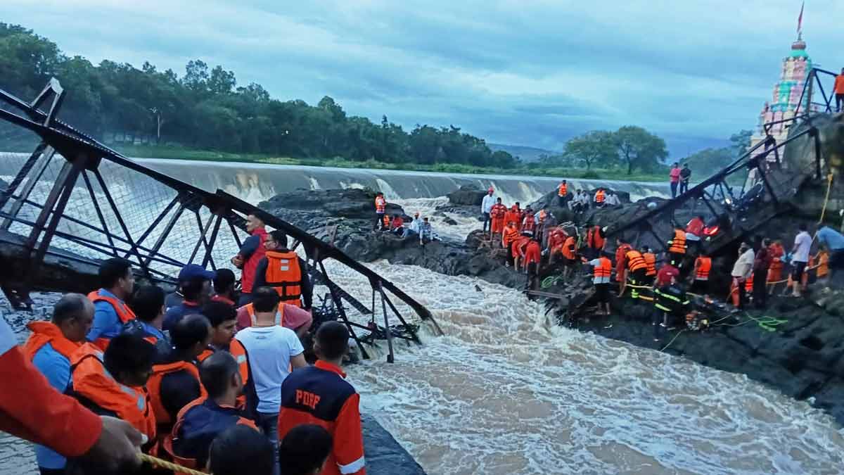 Rescuers work at the site of a bridge collapse near Pune | AP