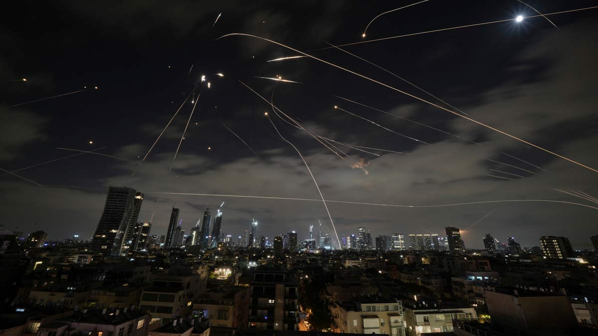 The Israeli Iron Dome air defense system fires to intercept missiles during an Iranian attack over Tel Aviv | AP