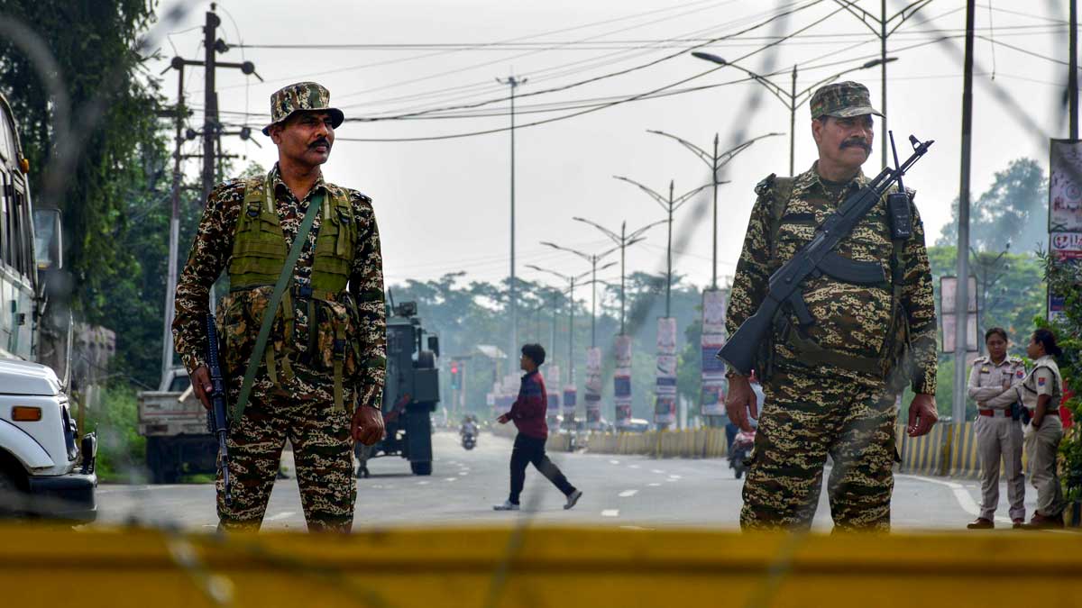 Security personnel stand guard on a road in Imphal East district of Manipur, a day after protests erupted over the arrest of a leader of Meitei outfit Arambai Tenggol | PTI