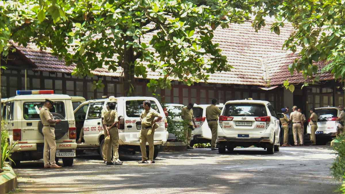 Police personnel at the office of the SIT constituted to probe the case related to the alleged mass burial in Dharmasthala of Dakshina Kannada district, in Mangaluru | PTI