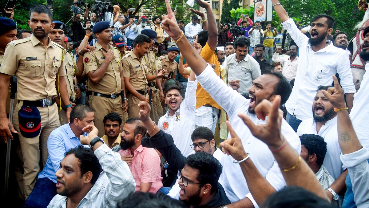  Members of Maharashtra Navnirman Sena demonstrate to counter a protest staged earlier by traders against the slapping of a food stall owner for not speaking in Marathi, at Mira road in Mumbai | PTI