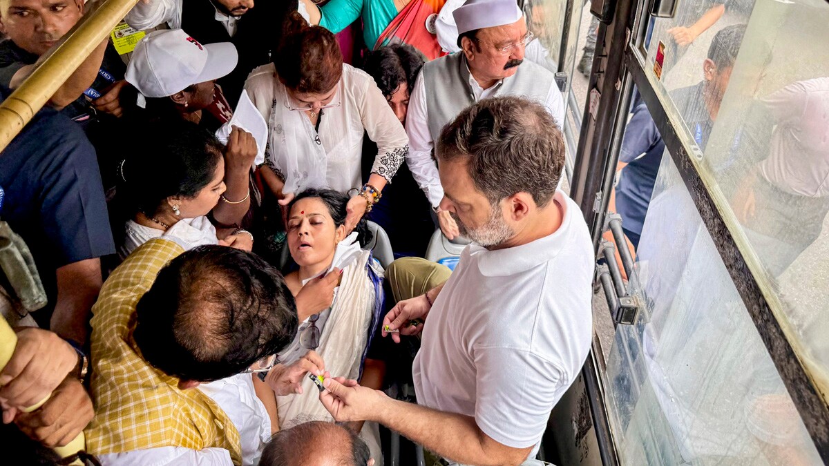 **EDS: THIRD PARTY IMAGE** In this image via AICC, LoP in the Lok Sabha and Congress leader Rahul Gandhi with other parliamentarians attends to TMC MP Mahua Moitra after she fainted during a protest march by INDIA bloc MPs from Parliament House to the Election Commission of India against the revision of electoral rolls in Bihar and alleged "vote chori", in New Delhi, Monday, Aug. 11, 2025. (AICC via PTI Photo)(PTI08_11_2025_000248B)