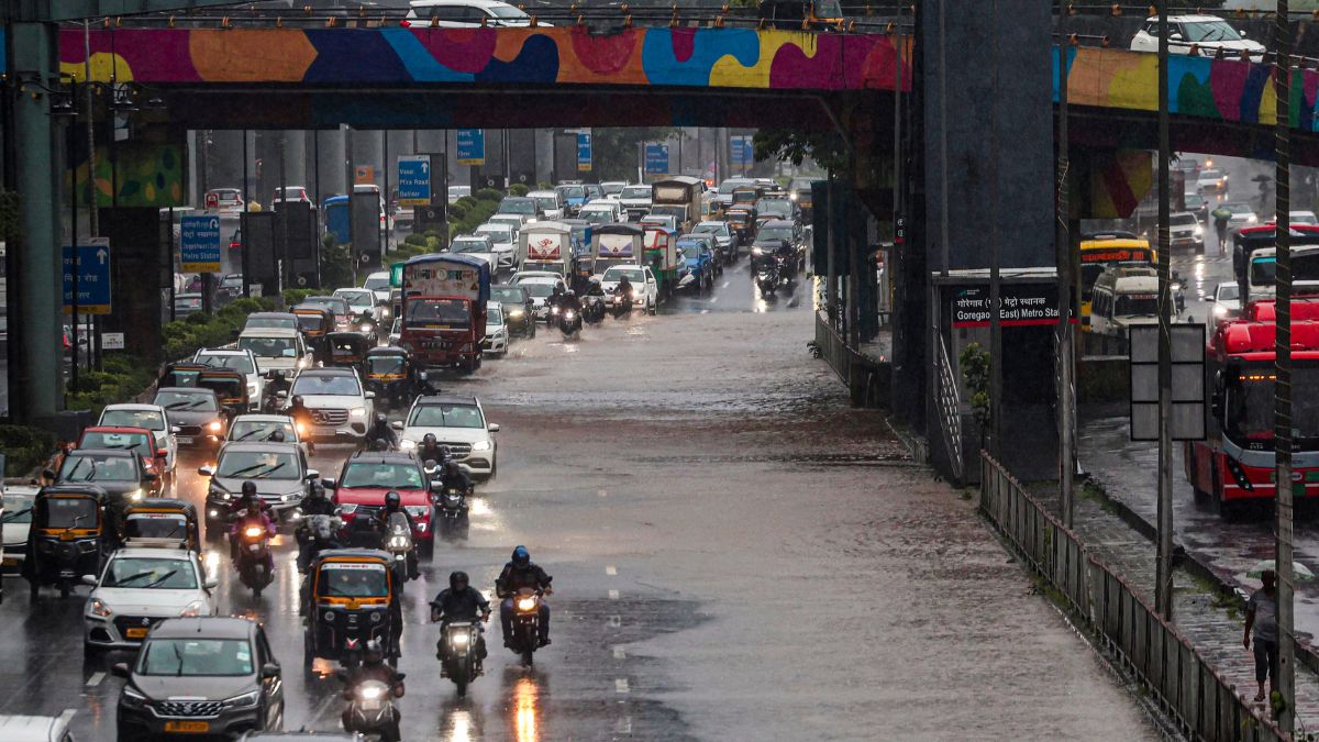  Commuters during a rainy day, at Goregaon, in Mumbai | PTI 
