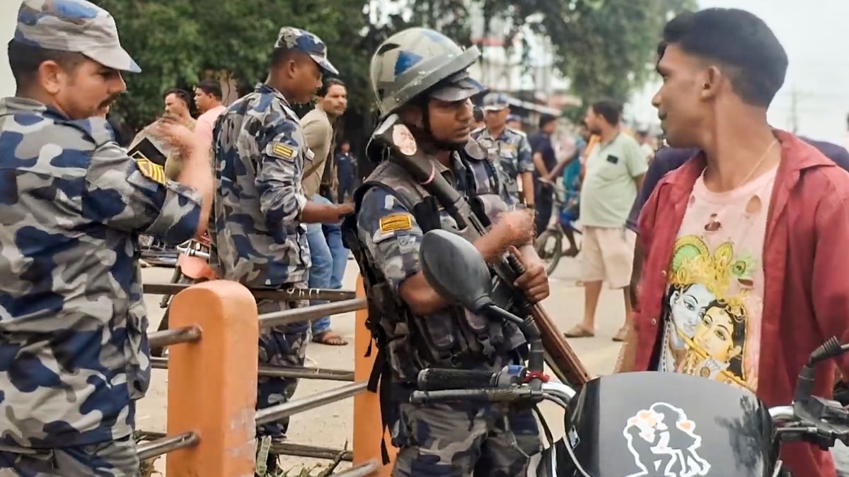 A commuter undergoes security checks at the India-Nepal border in the aftermath of anti-government protests, in Banke district | PTI 