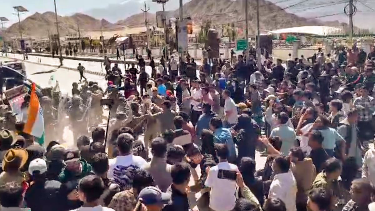 Security personnel try to stop agitators amid a protest and shutdown, in Leh, Ladakh | PTI 