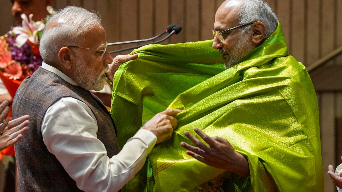 **EDS: FILE IMAGE** New Delhi: In this Tuesday, Aug. 19, 2025 file photo, Prime Minister Narendra Modi felicitates Maharashtra Governor CP Radhakrishnan during the NDA parliamentary party meeting, in New Delhi. NDA candidate C P Radhakrishnan won the vice presidential election on Tuesday by bagging 452 votes, while opposition candidate B Sudershan Reddy polled 300 votes, Returning Officer P C Mody said. (PTI Photo/Shahbaz Khan) (PTI09_09_2025_000462A)