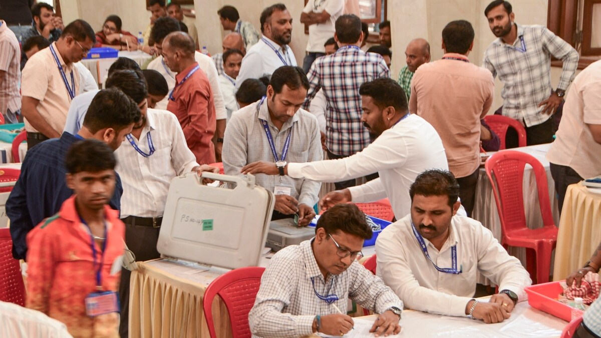 Names and symbols of party candidates being fed into Electronic Voting Machines (EVMs) under the supervision of polling officials ahead of the Brihanmumbai Municipal Corporation elections | PTI