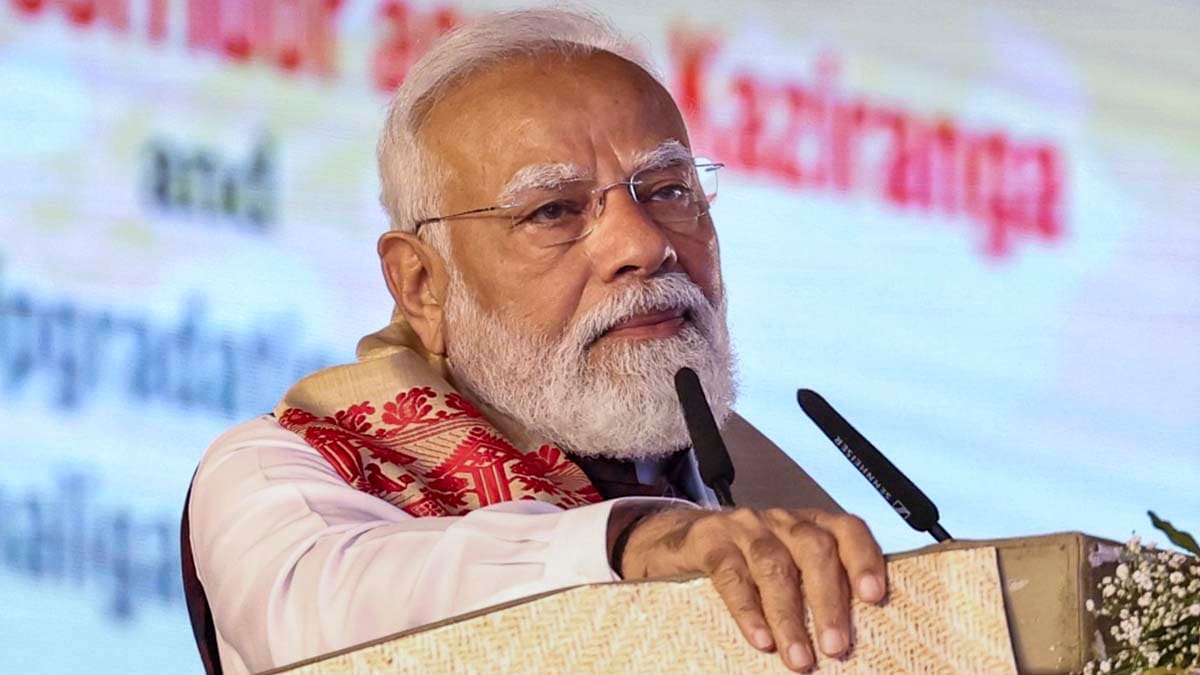 **EDS: THIRD PARTY IMAGE** In this image received on Jan. 18, 2026, Prime Minister Narendra Modi addresses the gathering during the foundation stone laying ceremony for the Kaziranga Elevated Corridor, in Nagaon district, Assam. PM Modi also virtually flagged off two Amrit Bharat trains in the district. (PMO via PTI Photo) (PTI01_18_2026_000280B)