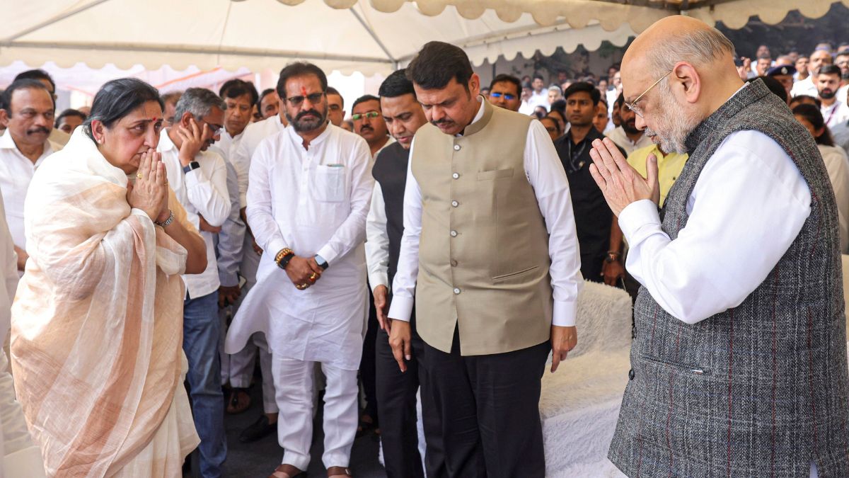 Union Home Minister Amit Shah greets Sunetra Pawar, wife of Maharashtra Deputy Chief Minister Ajit Pawar, during the latters funeral at the Vidya Pratishthan ground, in Baramati, Pune district. Maharashtra Chief Minister Devendra Fadnavis is also seen | PTI