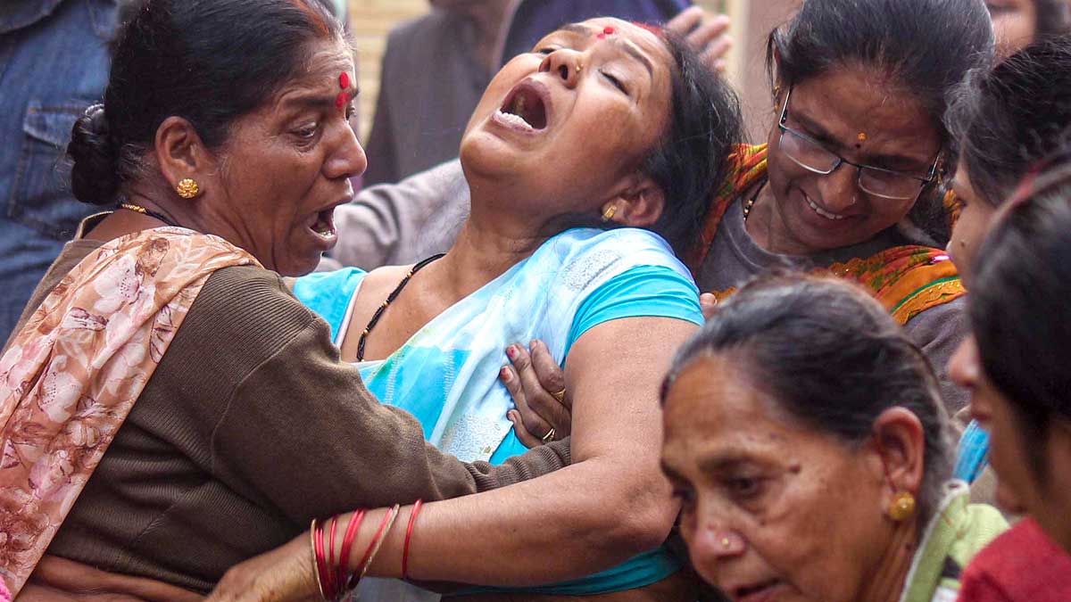 Family members of a victim, who died after consumption of allegedly contaminated water, mourn in the Bhagirathpura area of Indore | PTI