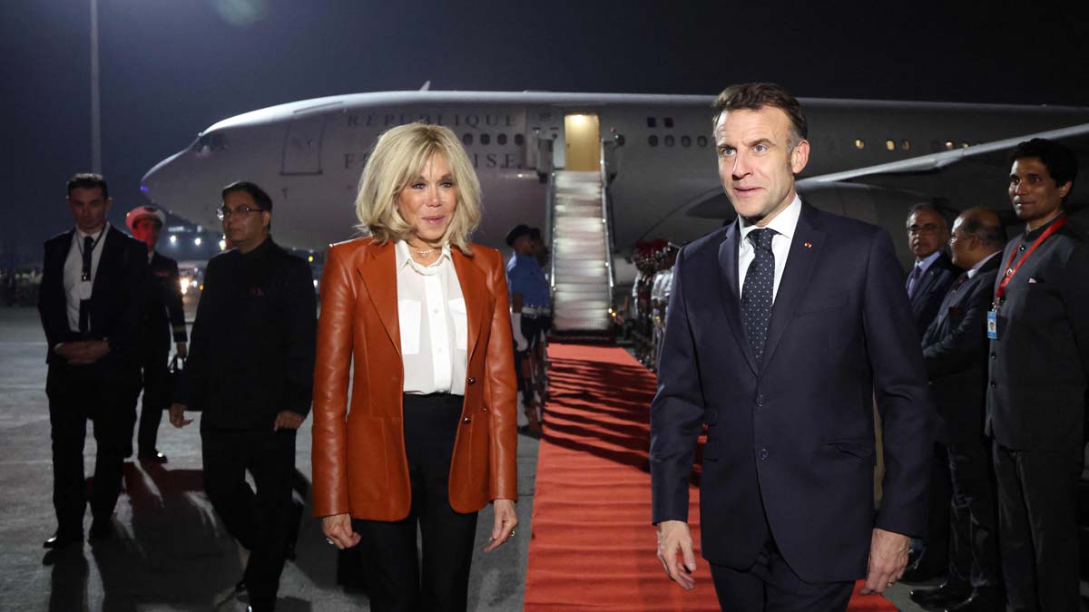 France's President Emmanuel Macron and wife Brigitte Macron on their arrival in Mumbai | AFP
