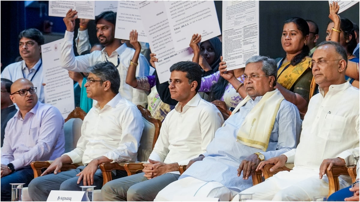 Newly recruited beneficiaries holding appointment letters pose with Karnataka Chief Minister Siddaramaiah | PTI