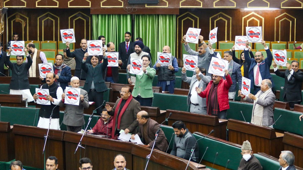 Members of the Legislative Assembly raise slogans as they protest, demanding the National Law University during the Budget session of the Jammu and Kashmir Assembly | PTI