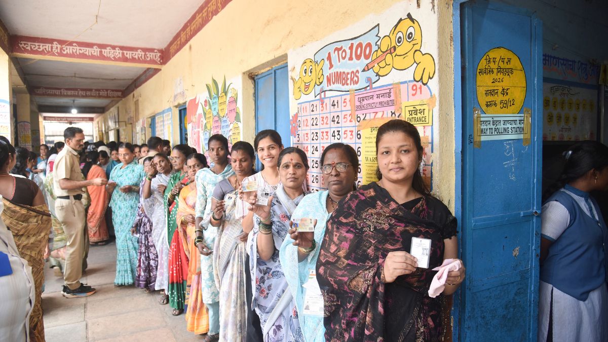 oters queue at a polling station during the Zilla Parishad and Panchayat Samiti elections, in Karad | PTI 