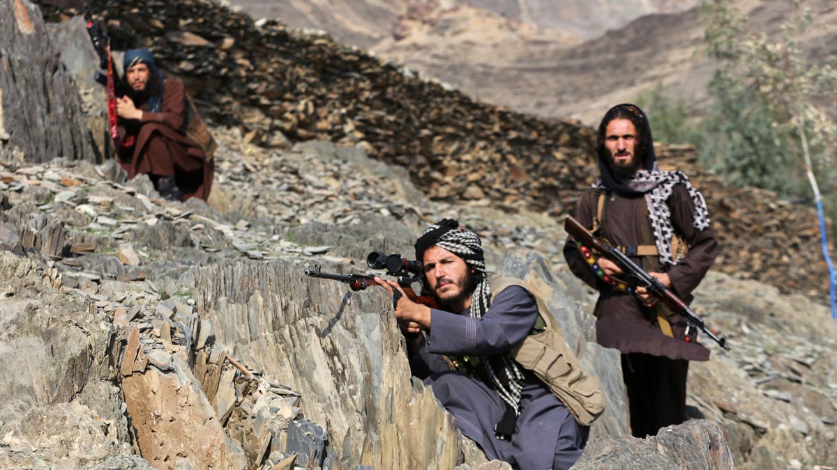 Afghan Taliban soldiers look toward the Pakistani side, on the Afghan side of the Torkham border crossing with Pakistan in Torkham | AP