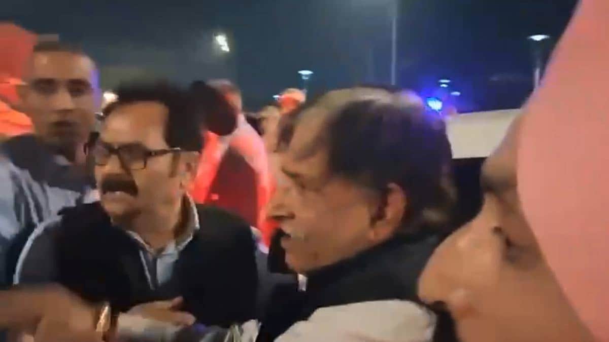 Kamal Singh Jamwal, centre, who allegedly fired a shot targeting National Conference president Farooq Abdullah, being detained by people | PTI