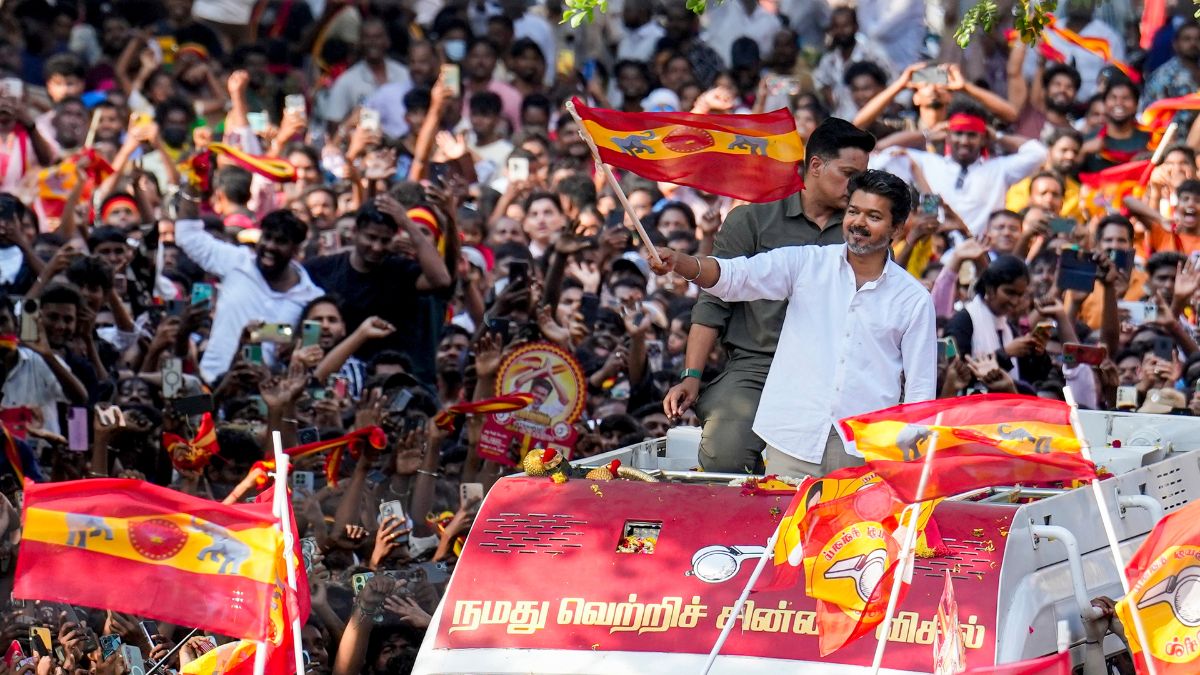 Tamilaga Vettri Kazhagam (TVK) chief Vijay waves the party flag during a public rally at Kolathur Assembly constituency | PTI